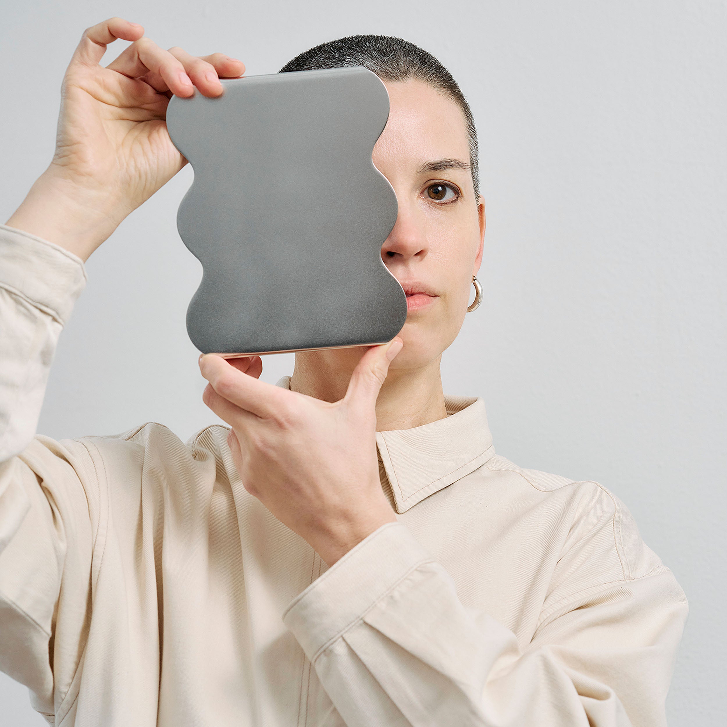 Portrait of Boyo designer Bojana Nikodijevic Liberti with modern stainless steel serving stand