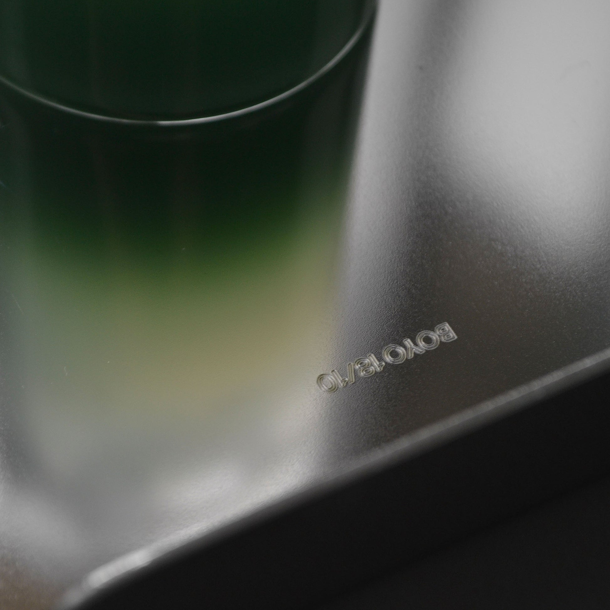Close-up of the logo detail on mirror stainless steel finish