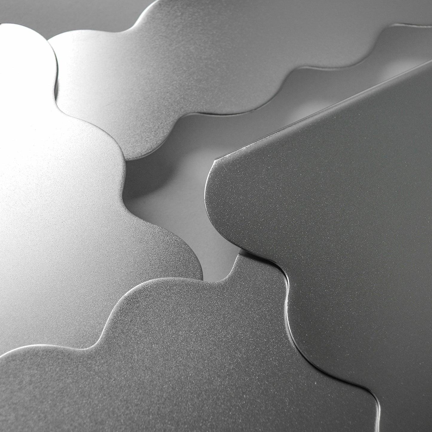 Close-up of stainless steel satin finish serving stands arranged into layers