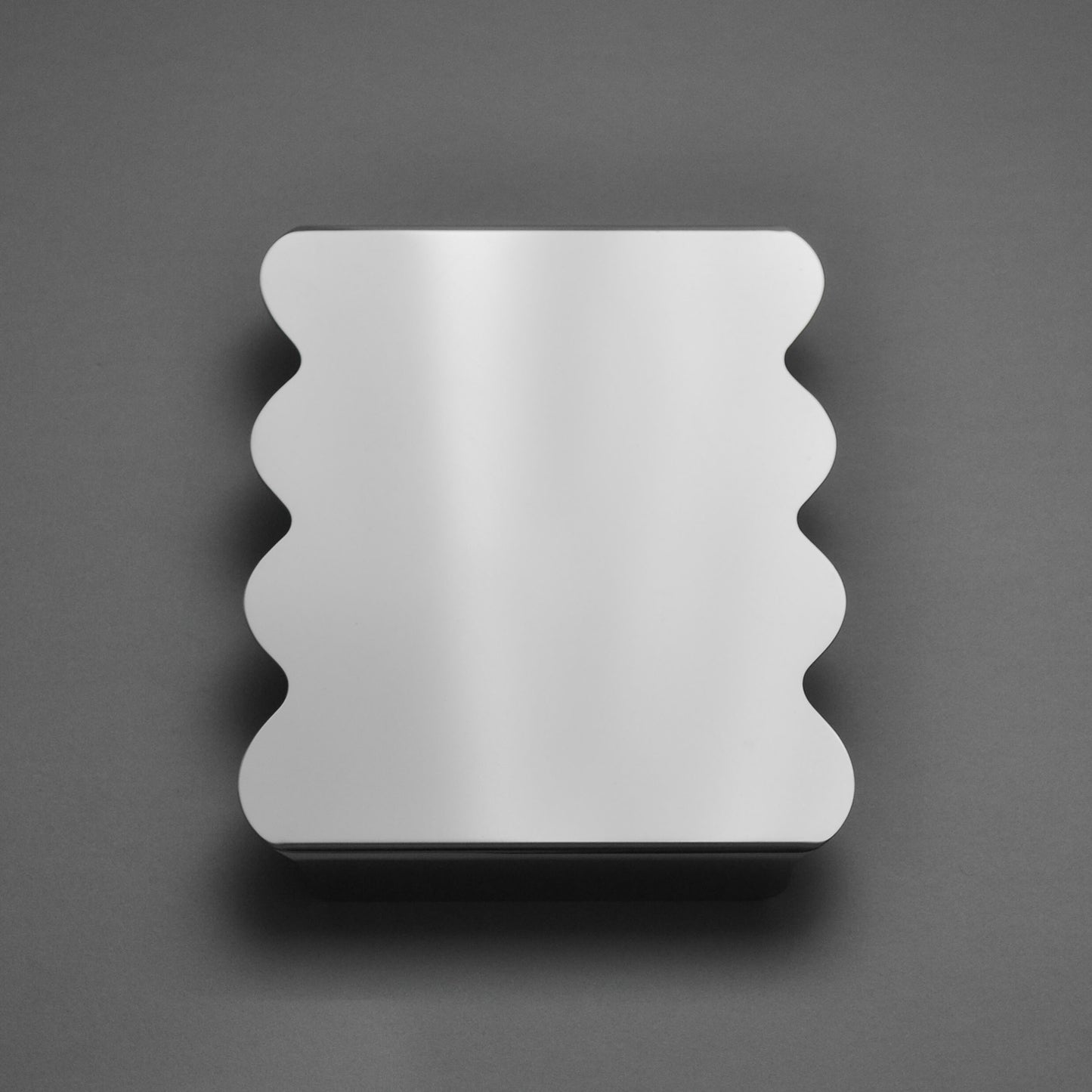 Contemporary Serving stand in Silk Mirror finish with sculpted wavy edges