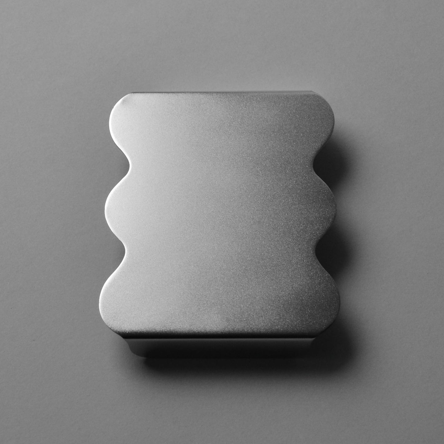 Front view of stainless steel satin finished seving stand with wavy edges