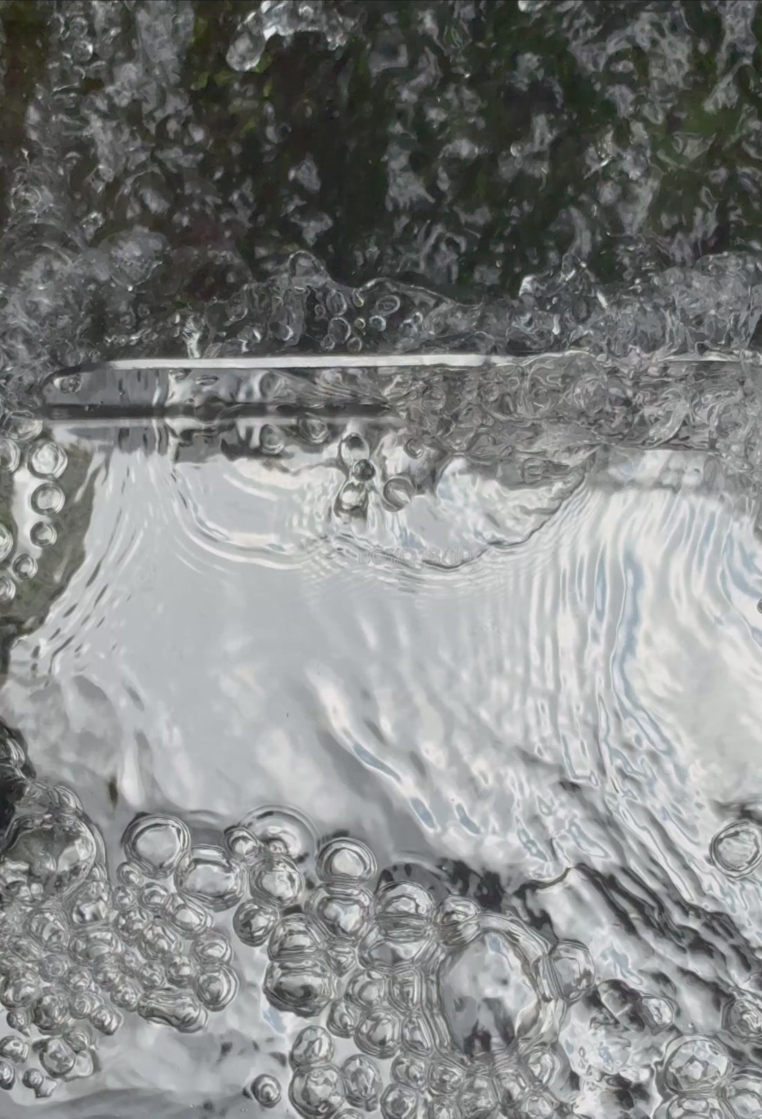 Sculptural stainless steel tray in the waterfall